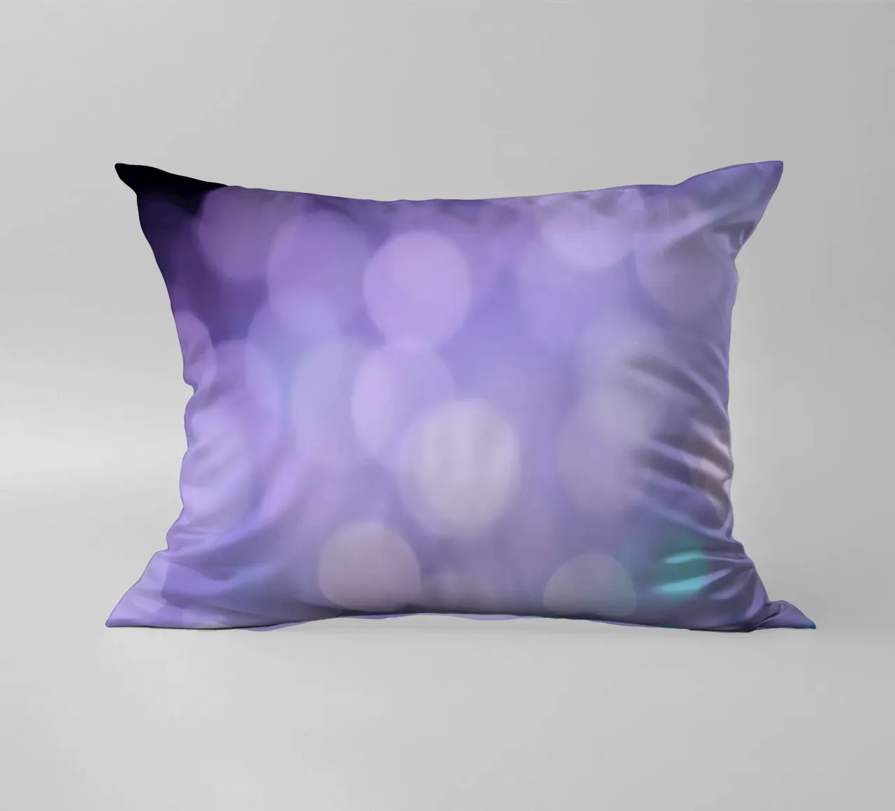 Sfondo bokeh con luci soffuse viola e blu cuscino da DesignDoodle