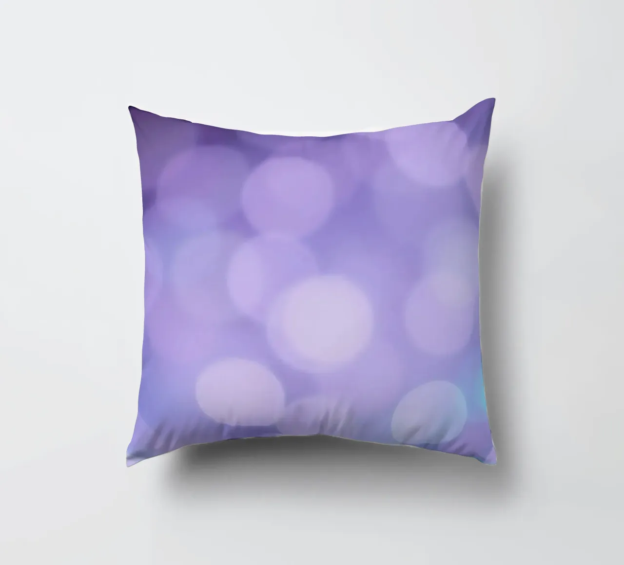 Sfondo bokeh con luci soffuse viola e blu cuscino da DesignDoodle