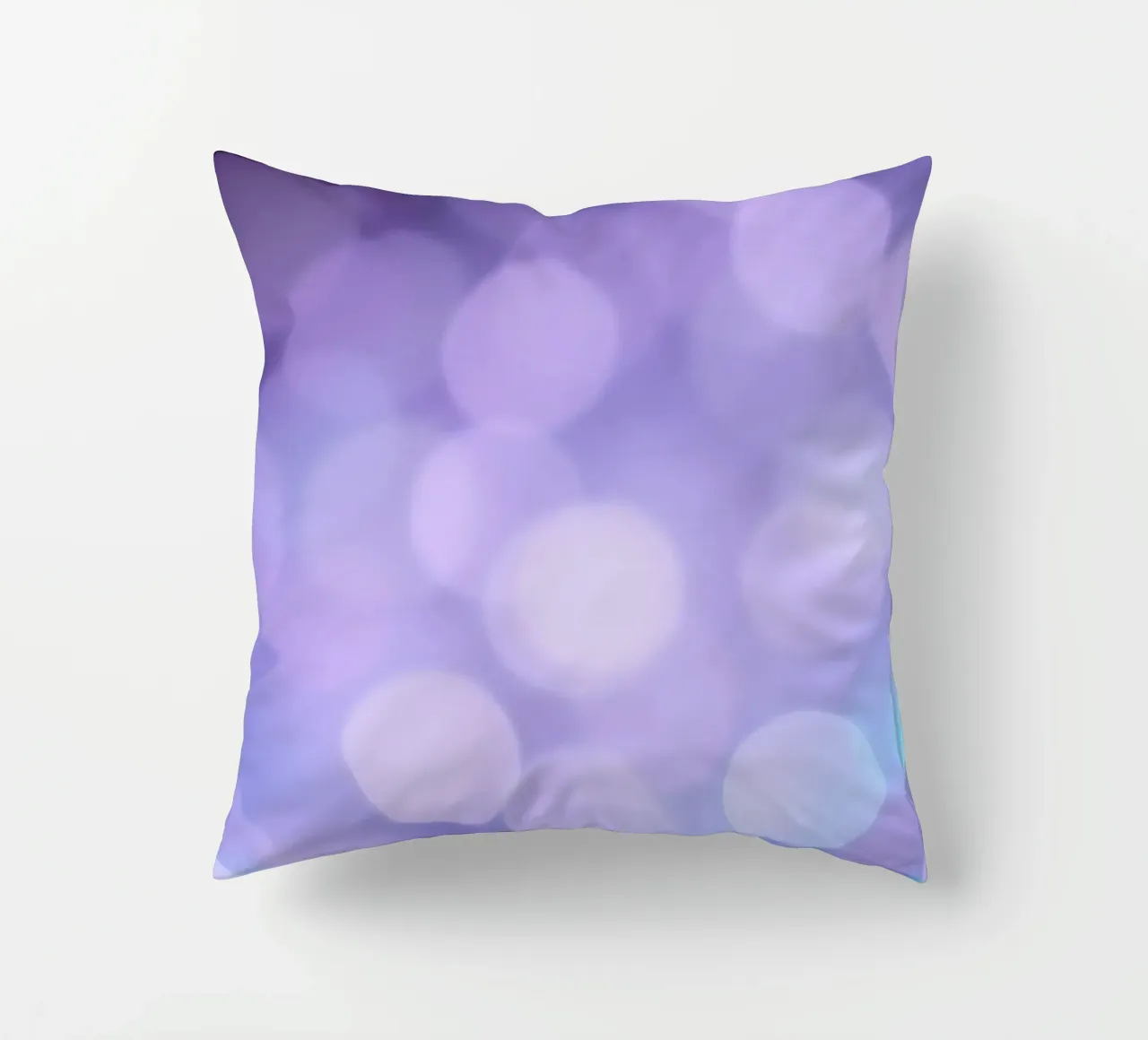 Sfondo bokeh con luci soffuse viola e blu cuscino da DesignDoodle