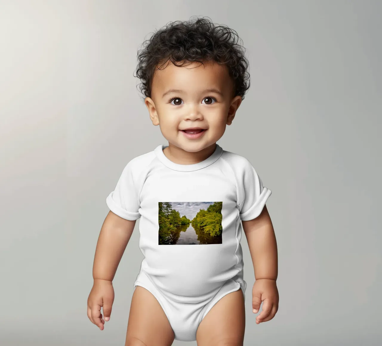 View of the river Saale with reflections of the trees on the bank short-sleeve baby romper by Marcus Beckert | Fotografie
