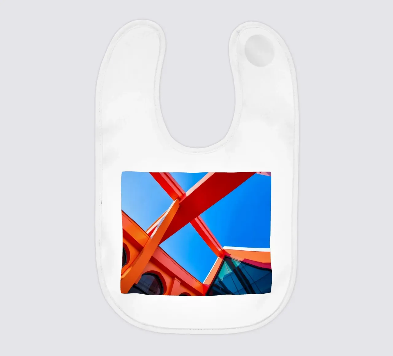 geometric architecture under clear blue sky captures modern baby bib by DesignDoodle