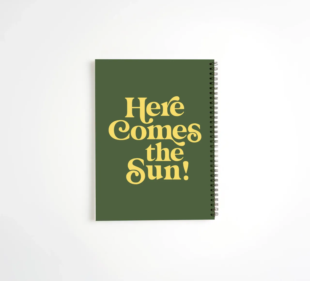 Here Comes the Sun Typography Print in Green and Yellow spiral notebook by THE MOTIVATED TYPE
