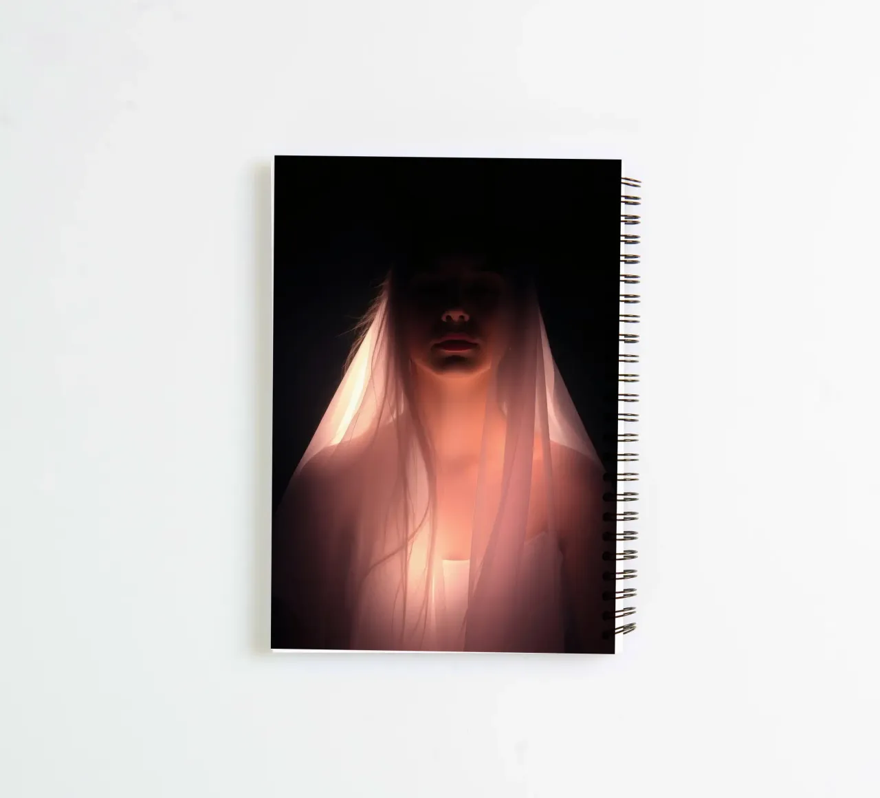 figure with a veil illuminated from below in a dark space spiral notebook by DesignDoodle