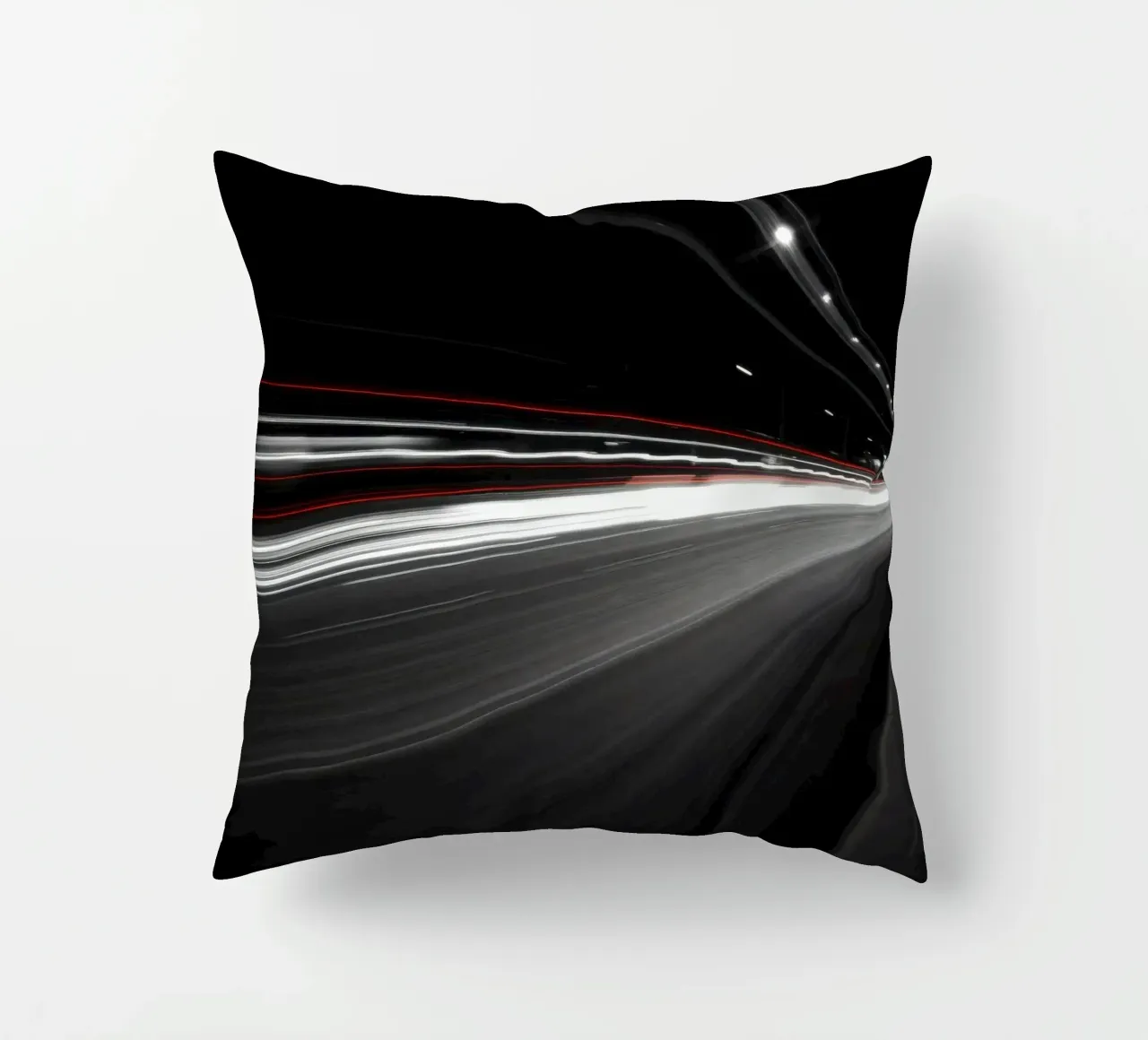 Dynamic lights create streaks on a busy city road decorative cushion by DesignDoodle