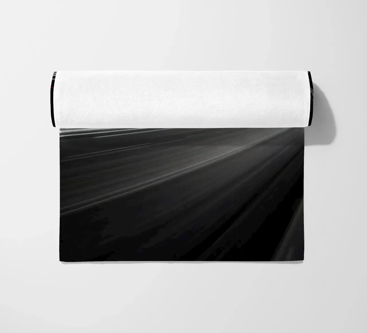 Dynamic lights create streaks on a busy city road beach towel by DesignDoodle