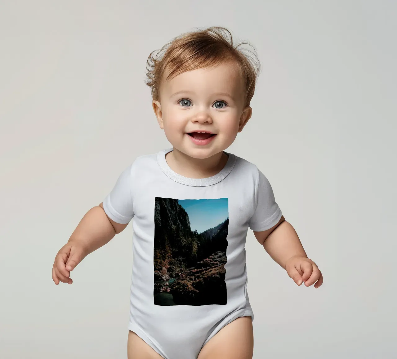 Mountain River short-sleeve baby romper by Sebastian Hilgetag