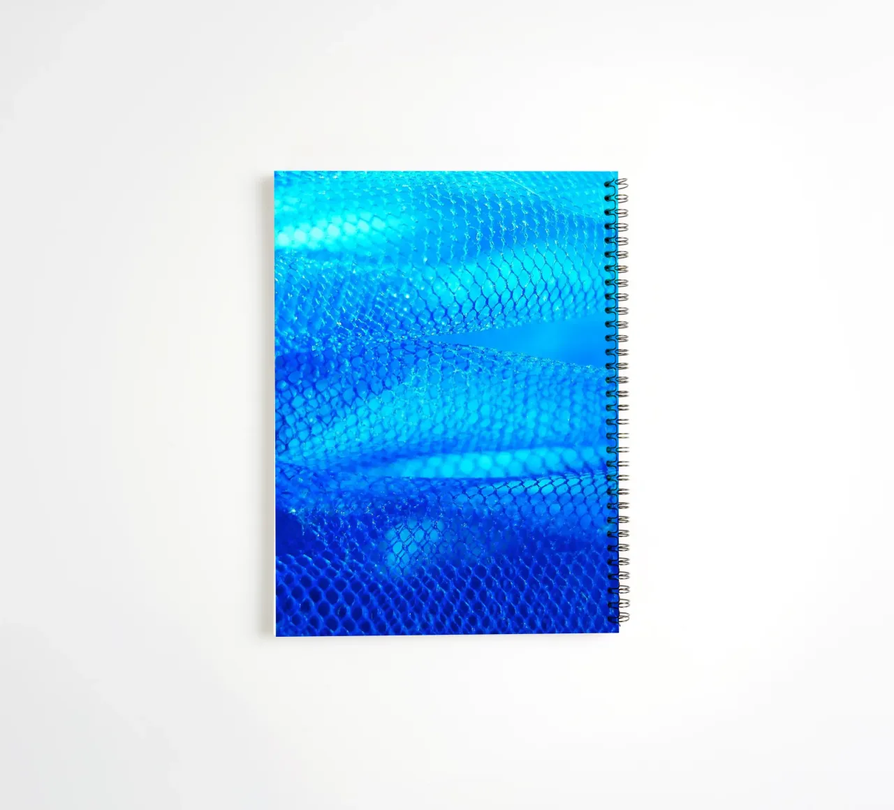 Blue spiral notebook by Inge Hauser Illustration