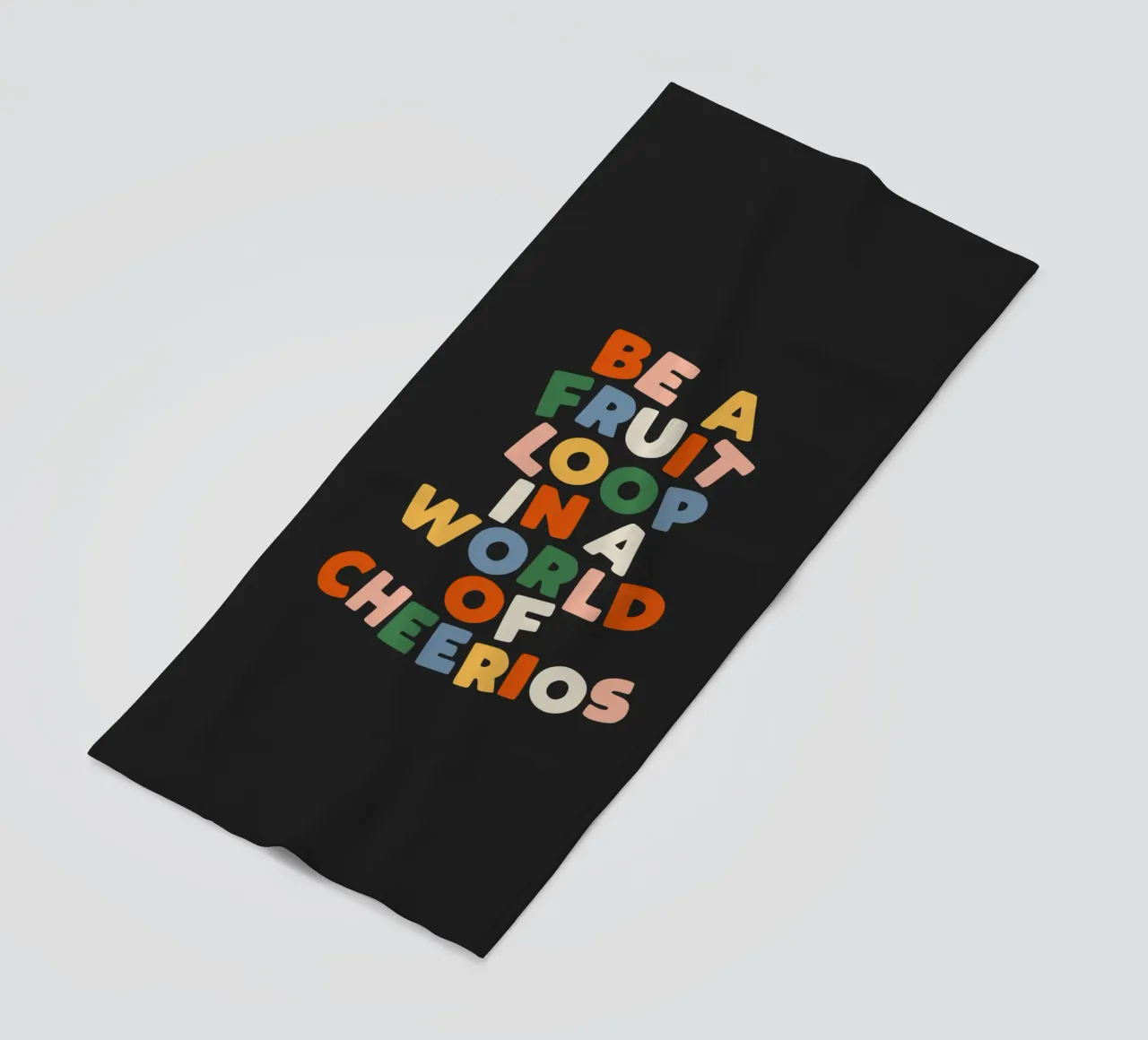 Be a Fruitloop in a World of Cheerios Typografie Druck Strandtuch von THE MOTIVATED TYPE