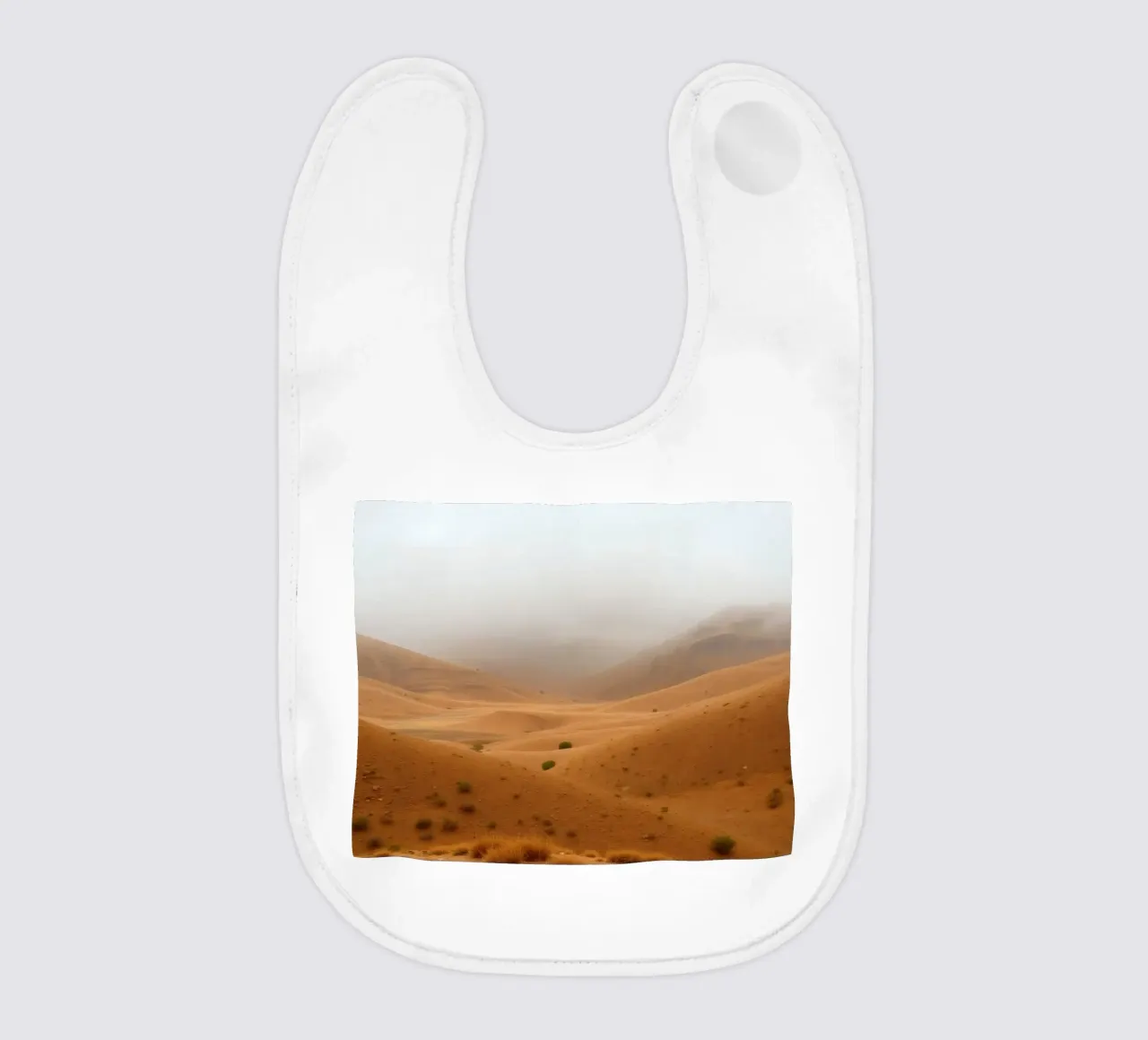 desert landscape under cloudy sky with gentle rolling dunes baby bib by DesignDoodle
