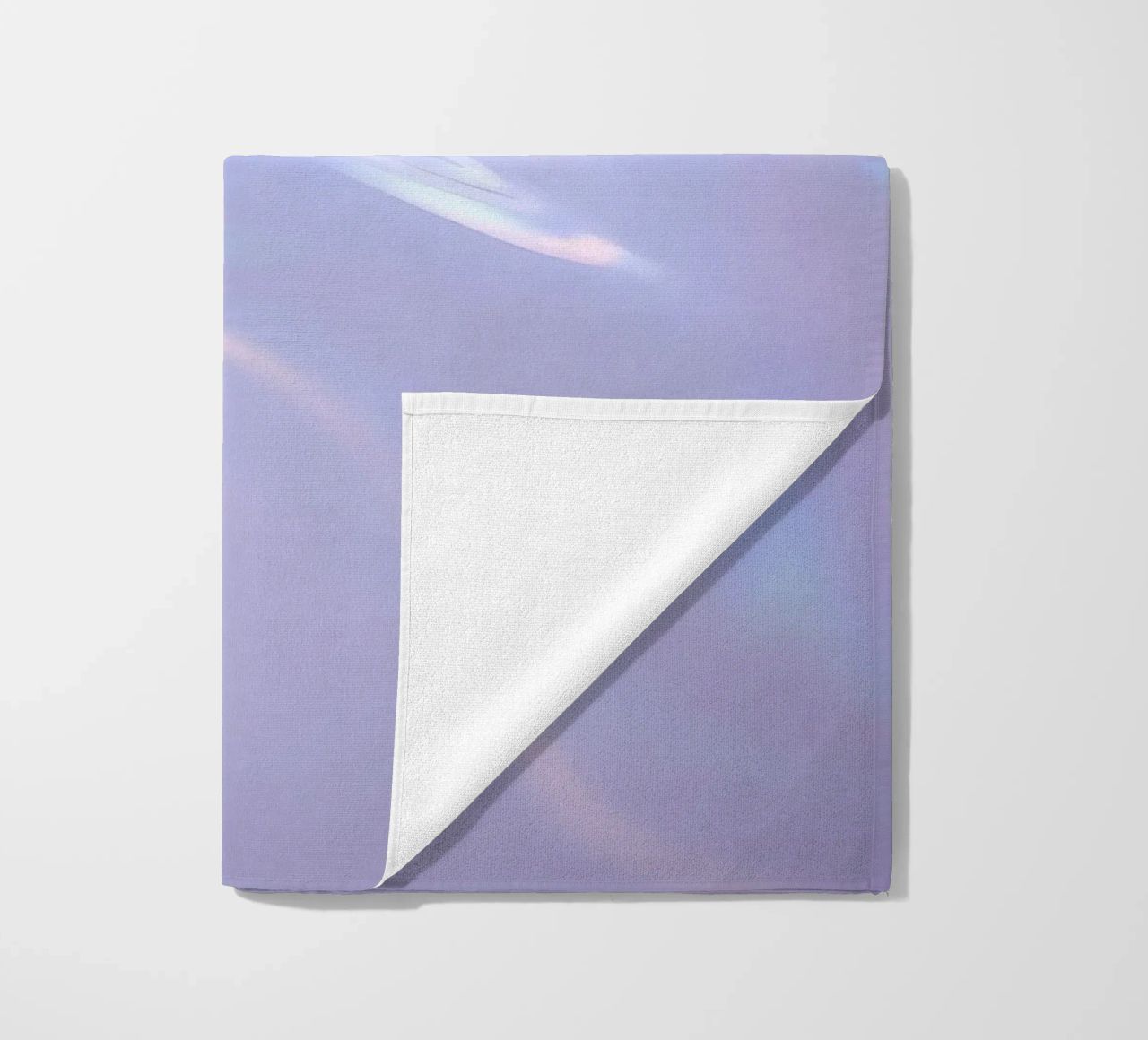 surface reflecting soft colors and patterns beach towel by DesignDoodle