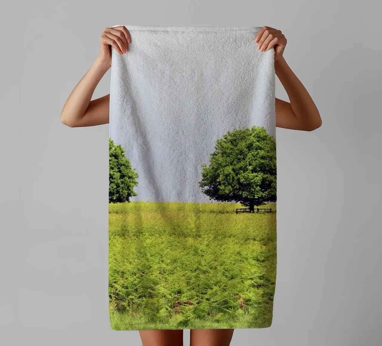 Trees in a Field of Ferns under a Grey Sky towel by Jack C Photography