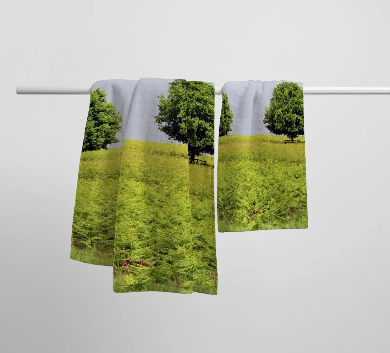 Trees in a Field of Ferns under a Grey Sky towel by Jack C Photography