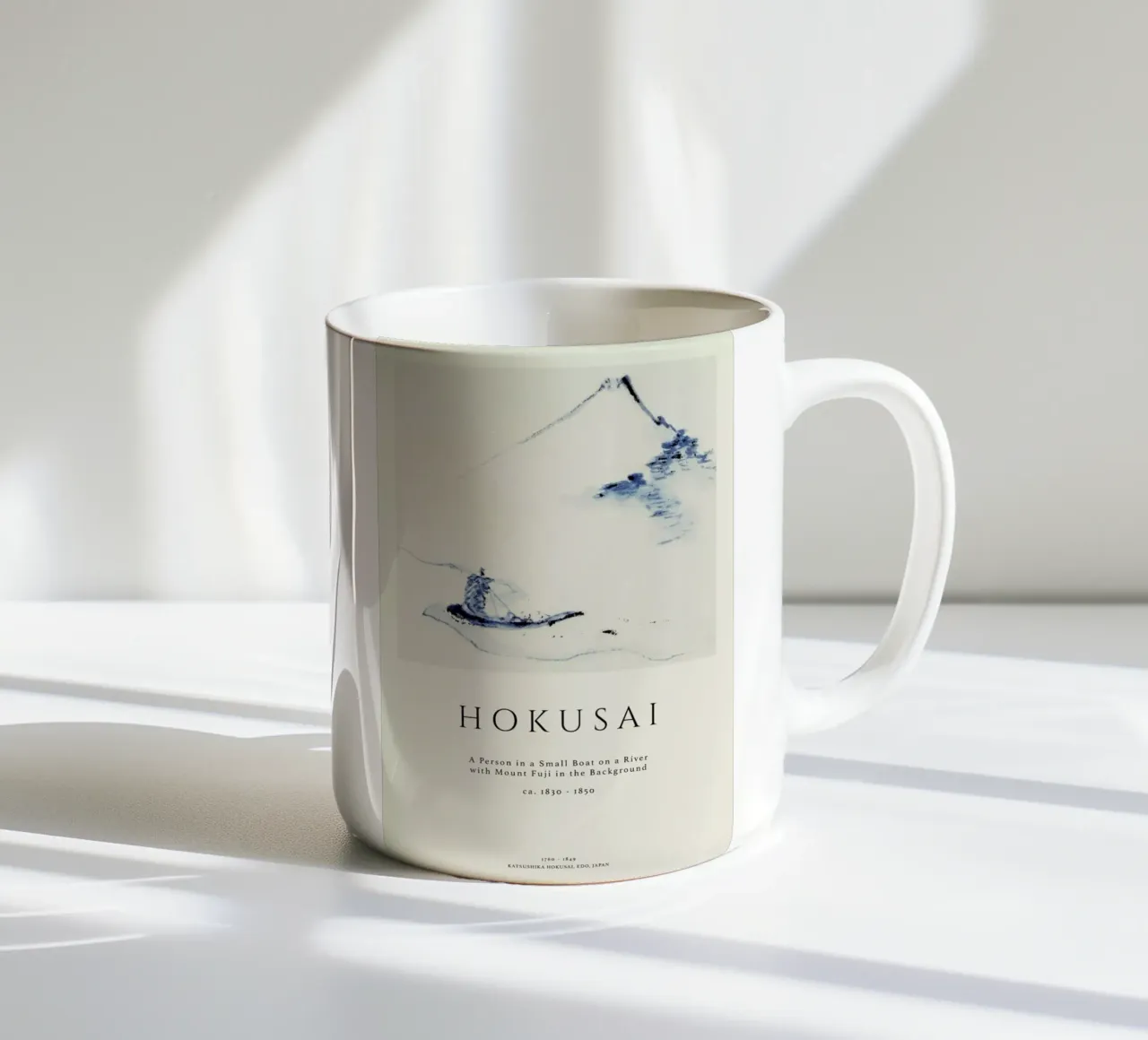 Hokusai - A Person in a Small Boat on a River with Mount Fuji in the Background II ceramic mug by Vintage by JUNIQE