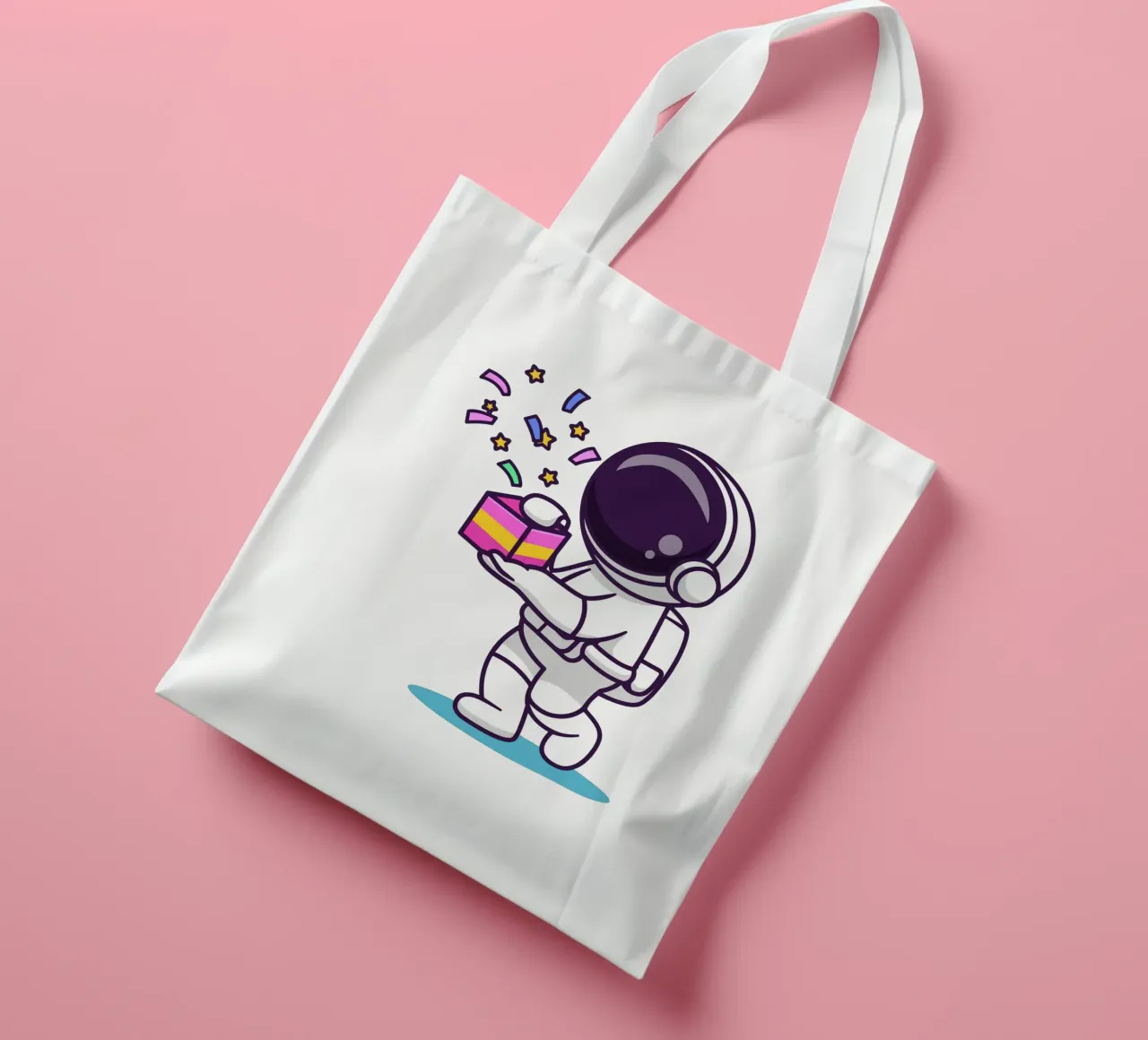 Simpatico astronauta con in mano una confezione regalo borsa in juta da brockcon Shop