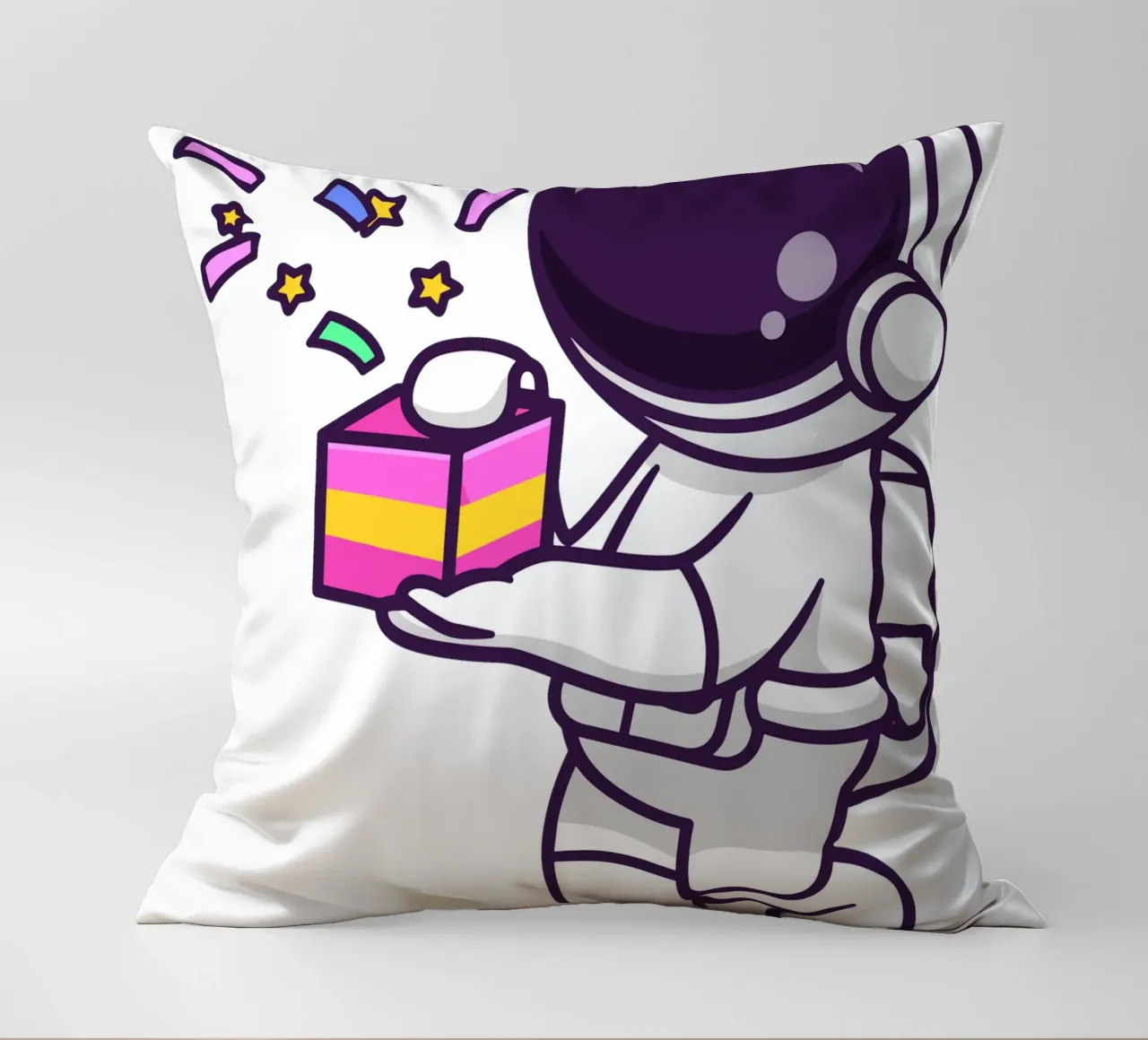 Simpatico astronauta con in mano una confezione regalo cuscino da brockcon Shop