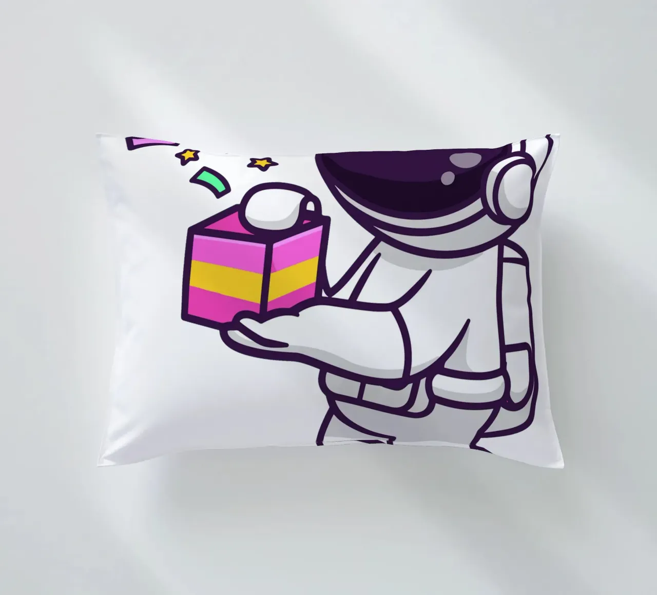 Simpatico astronauta con in mano una confezione regalo cuscino da brockcon Shop