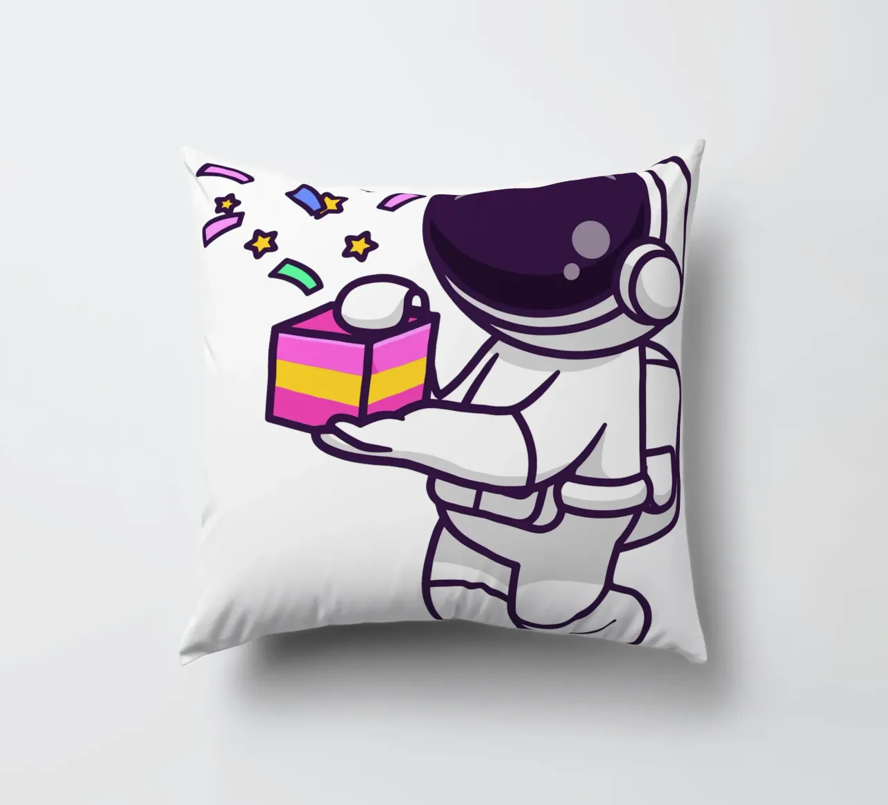 Simpatico astronauta con in mano una confezione regalo cuscino da brockcon Shop