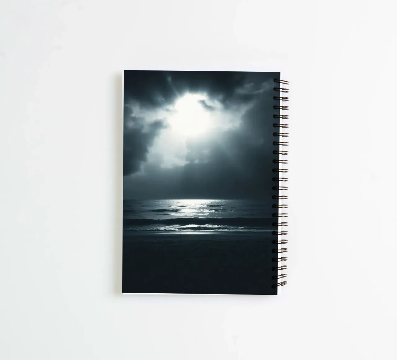 Serene nighttime ocean view illuminated by bright moonlight spiral notebook by DesignDoodle