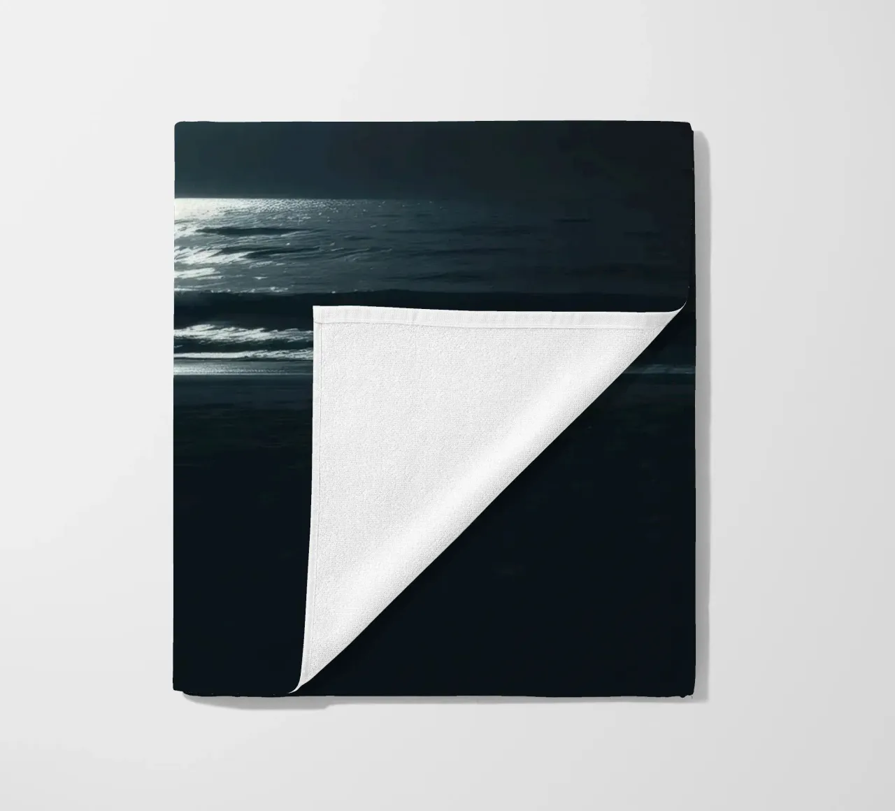 Serene nighttime ocean view illuminated by bright moonlight beach towel by DesignDoodle