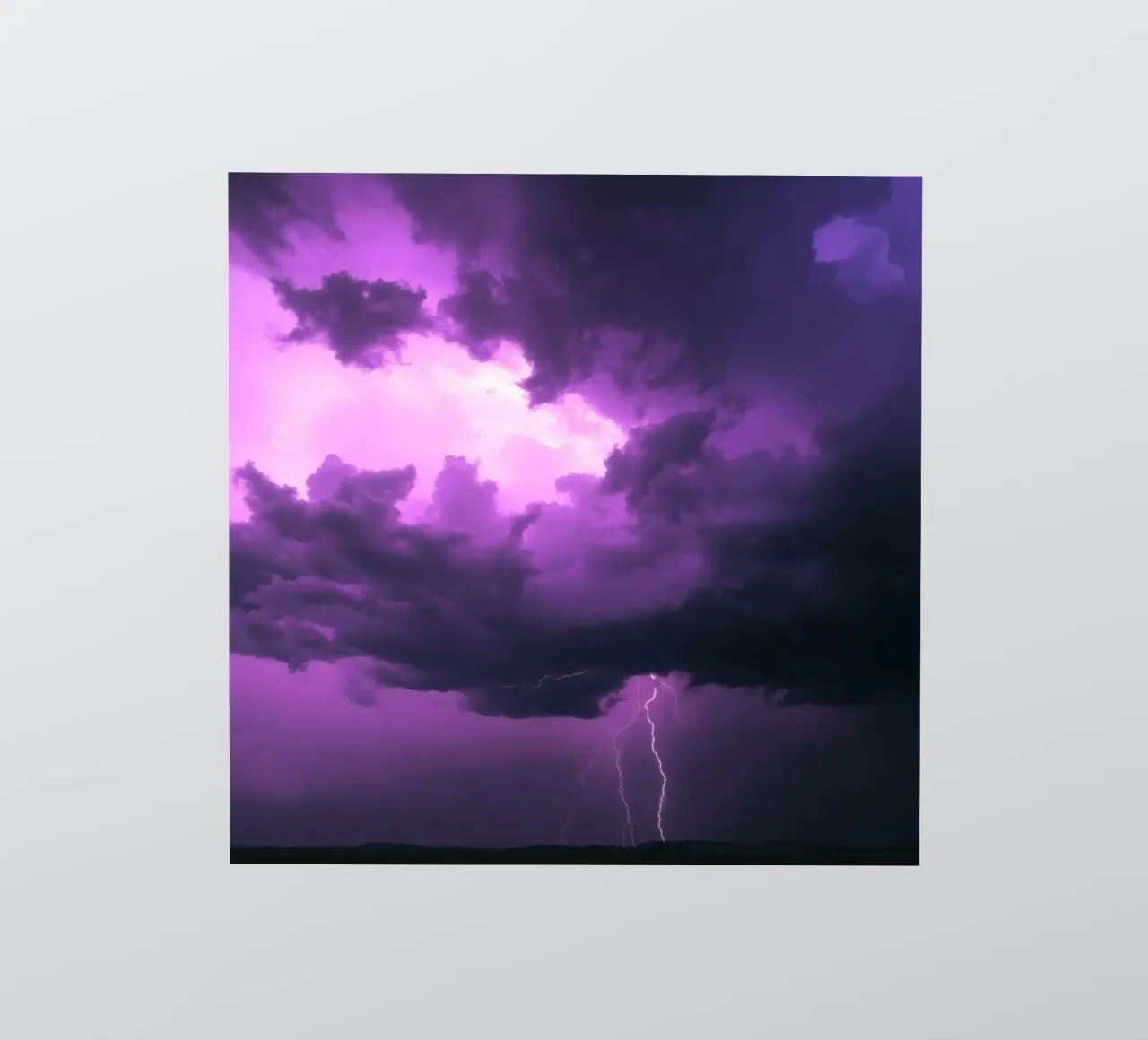Dramatic lightning strikes illuminate a purple stormy sky sticker by DesignDoodle