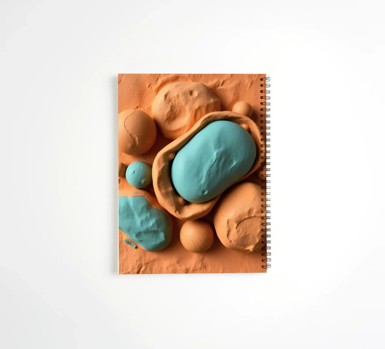 clay model depicting cellular structures, creatively crafted spiral notebook by DesignDoodle
