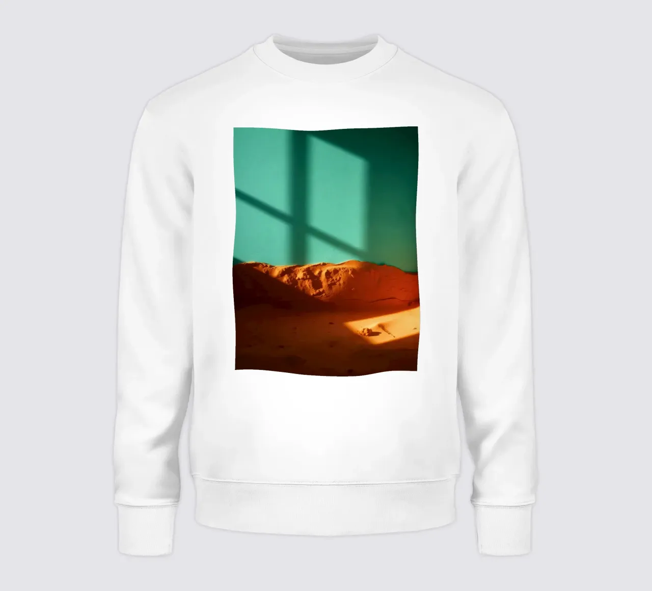 zonlicht werpt geometrische schaduwen op oranje zand en turkoois sweatshirt van DesignDoodle
