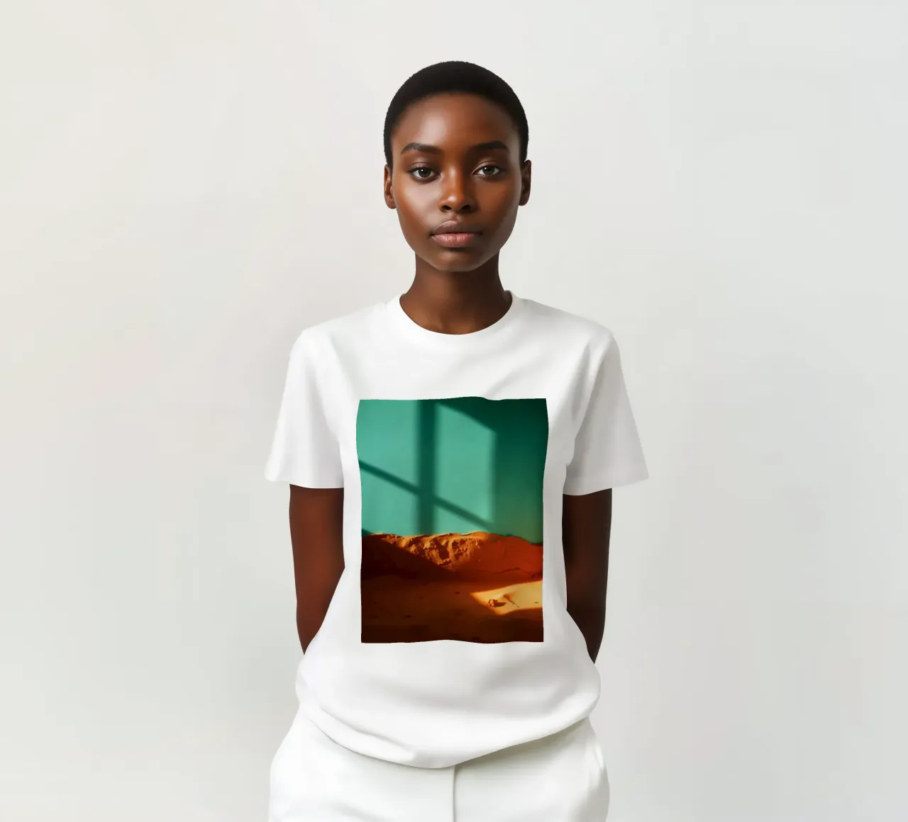 zonlicht werpt geometrische schaduwen op oranje zand en turkoois t-shirt van DesignDoodle