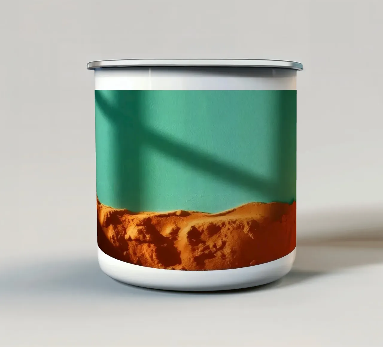 zonlicht werpt geometrische schaduwen op oranje zand en turkoois emaille mok van DesignDoodle