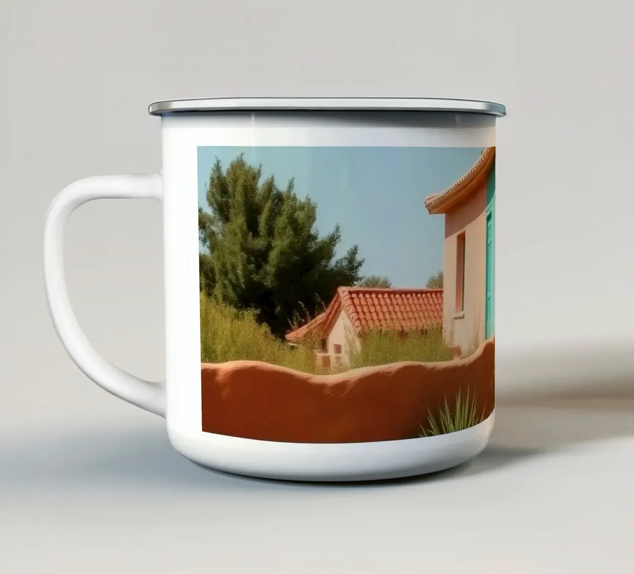 Casa dai colori vivaci con giardino in un soleggiato paesaggio desertico tazza in smalto da DesignDoodle