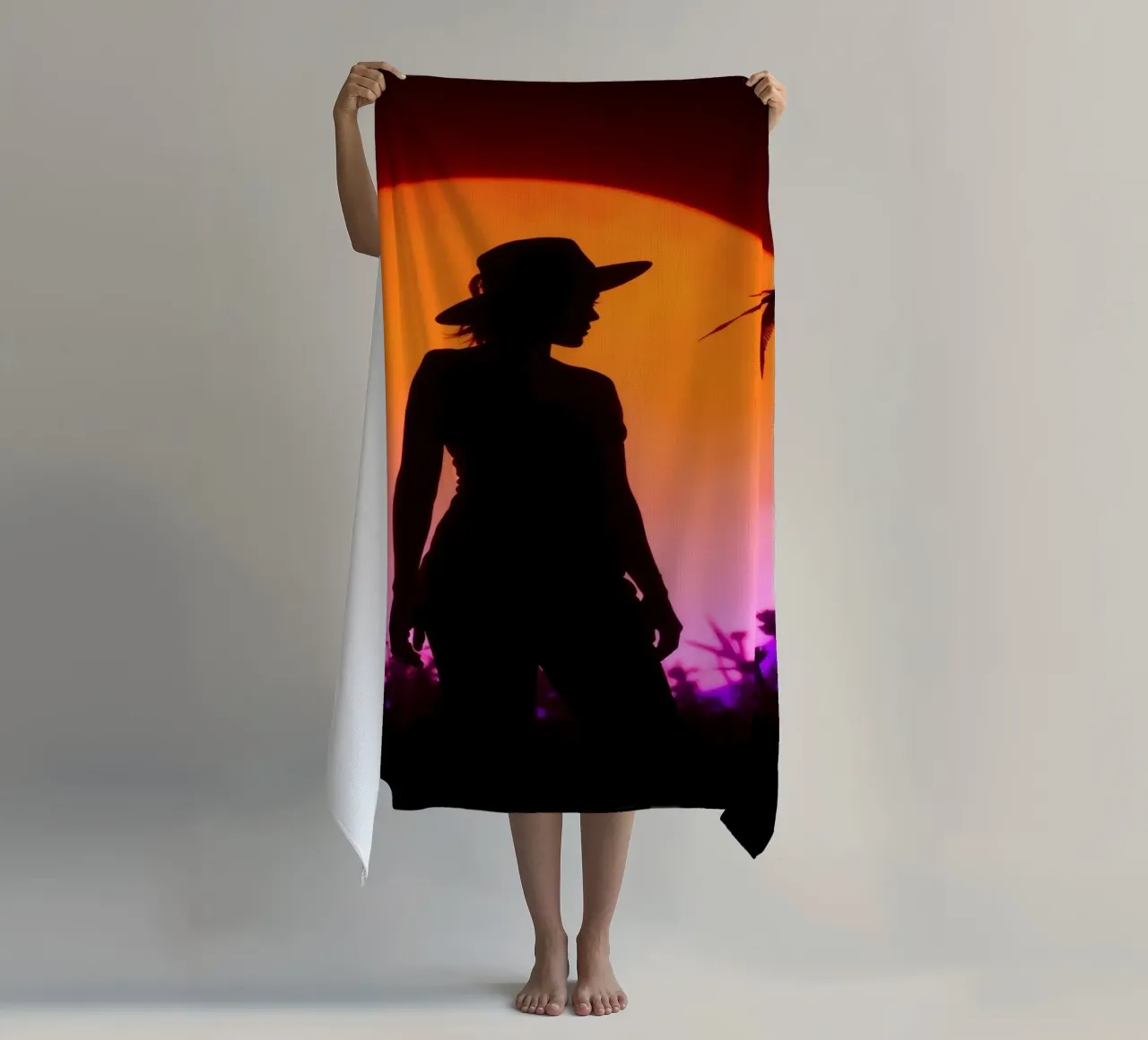 Silhouette of a woman in a hat, sunset with flying insects beach towel by DesignDoodle