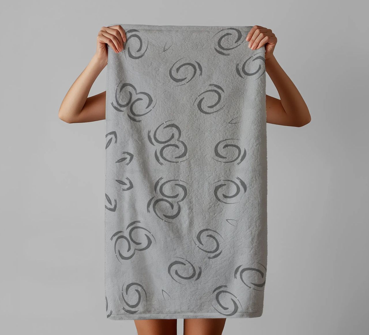 Abstract dynamic circular pattern in grey towel by Something for you