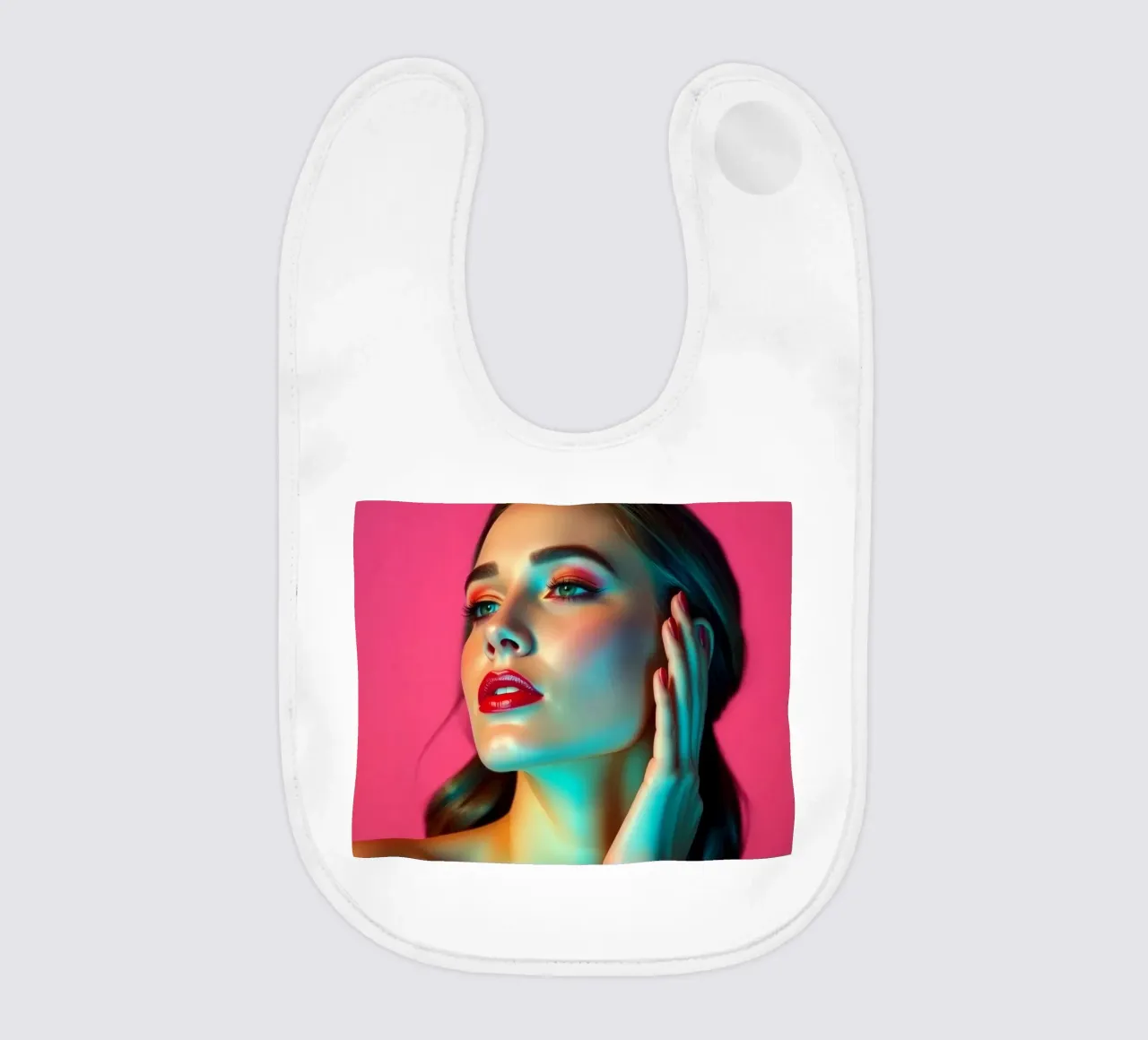 Beautiful woman with makeup against a bright pink background baby bib by DesignDoodle