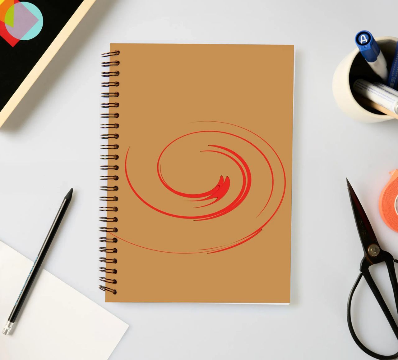 Abstract circular dynamic shape in red and orange spiral notebook by Something for you