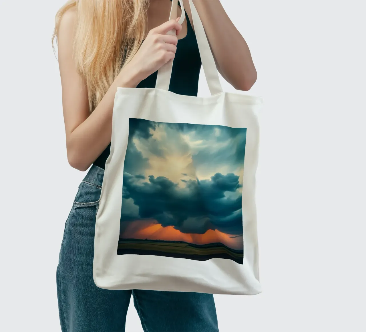 Dramatic sunset sky over open fields with towering clouds tote bag by DesignDoodle