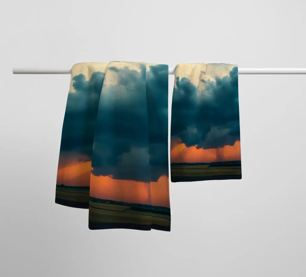 Dramatic sunset sky over open fields with towering clouds towel by DesignDoodle