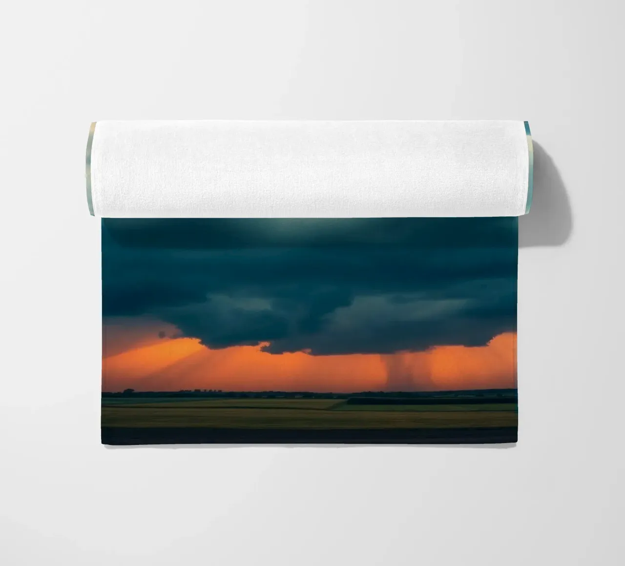 Dramatic sunset sky over open fields with towering clouds beach towel by DesignDoodle