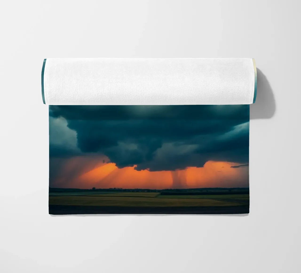 Dramatic sunset sky over open fields with towering clouds beach towel by DesignDoodle