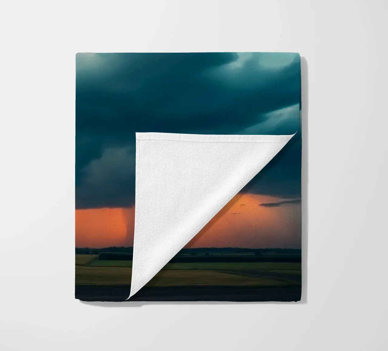 Dramatic sunset sky over open fields with towering clouds beach towel by DesignDoodle