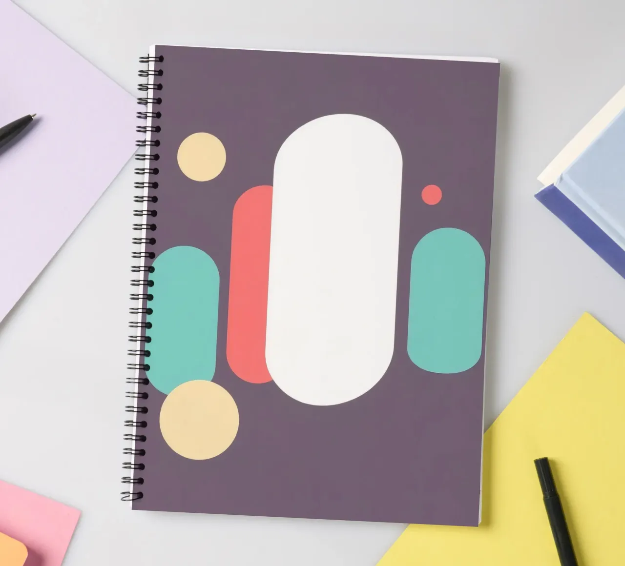 Abstract geometric shapes in soft colors on muted backgroud spiral notebook by DesignDoodle