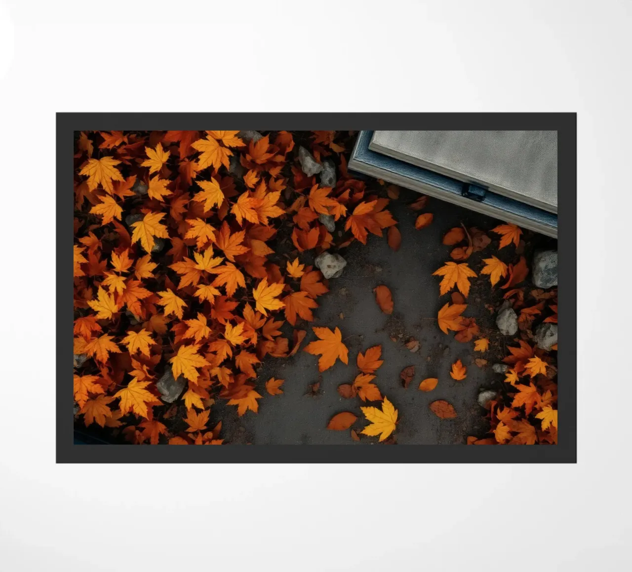 Golden autumn leaves scatter on the ground near a stone path doormat by DesignDoodle
