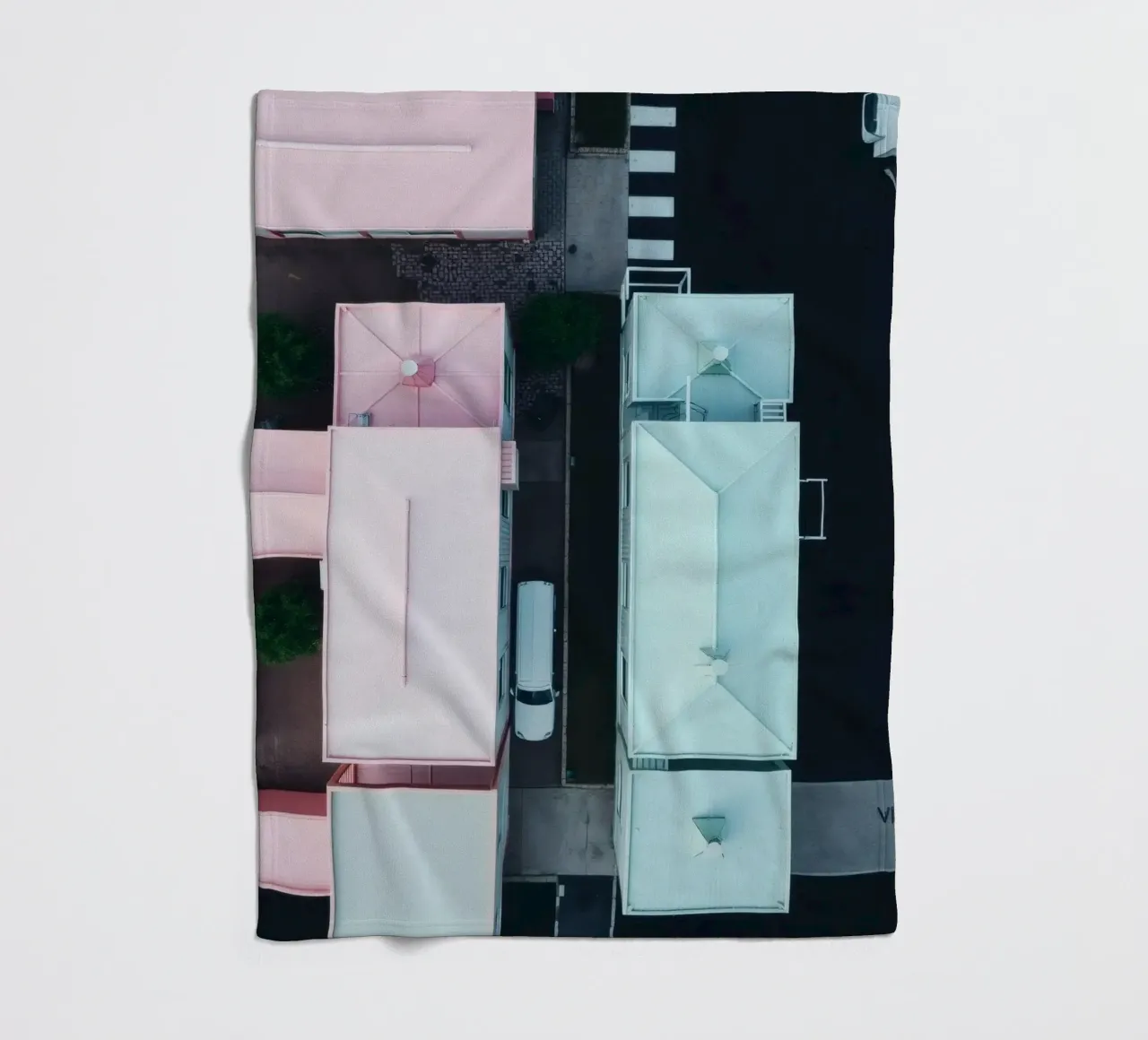 Unique aerial view of pastel-colored buildings with trees fleece blanket by DesignDoodle