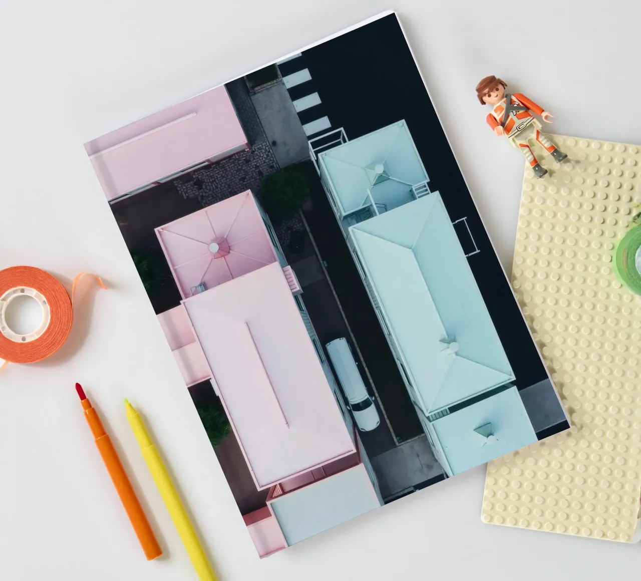 Unique aerial view of pastel-colored buildings with trees notebook by DesignDoodle