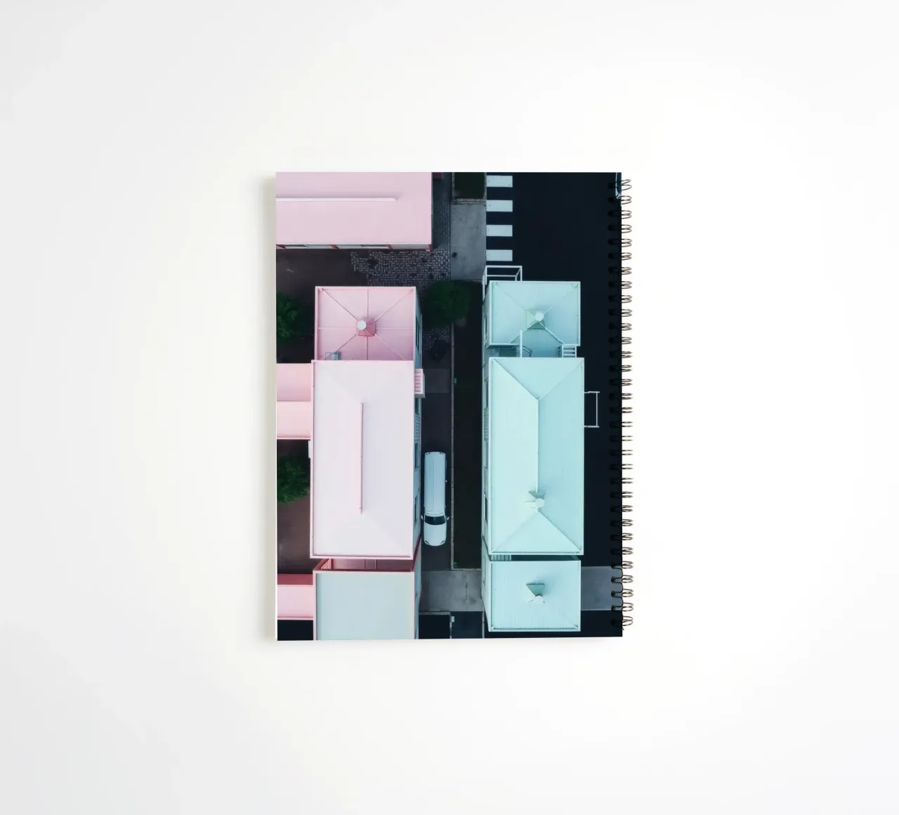 Unique aerial view of pastel-colored buildings with trees spiral notebook by DesignDoodle