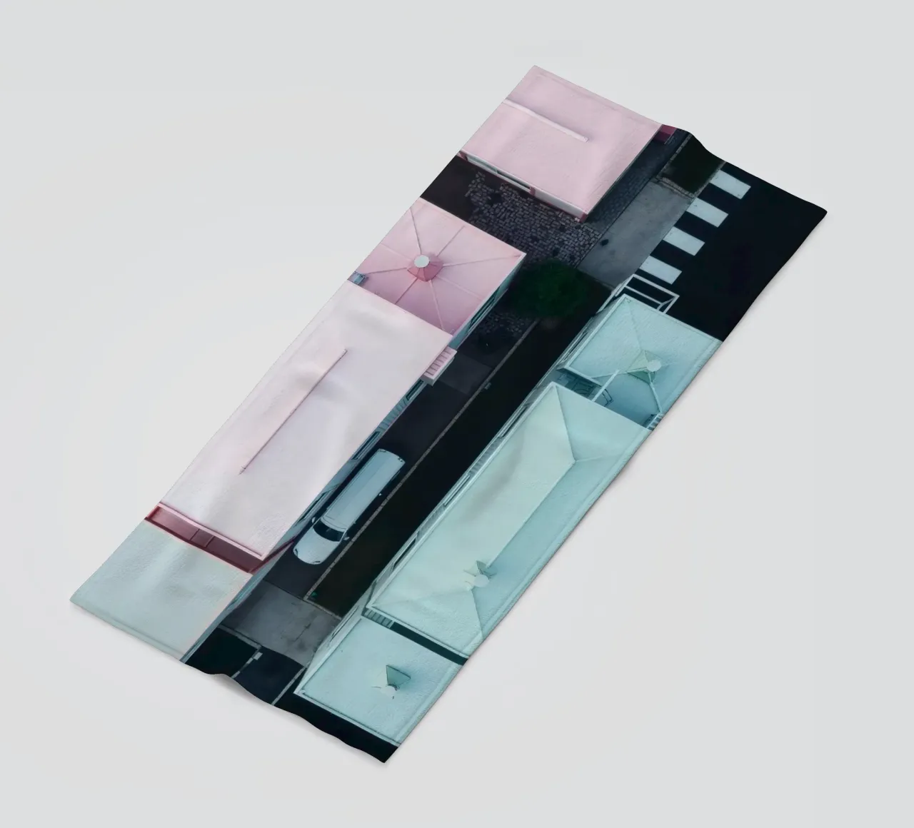 Unique aerial view of pastel-colored buildings with trees beach towel by DesignDoodle