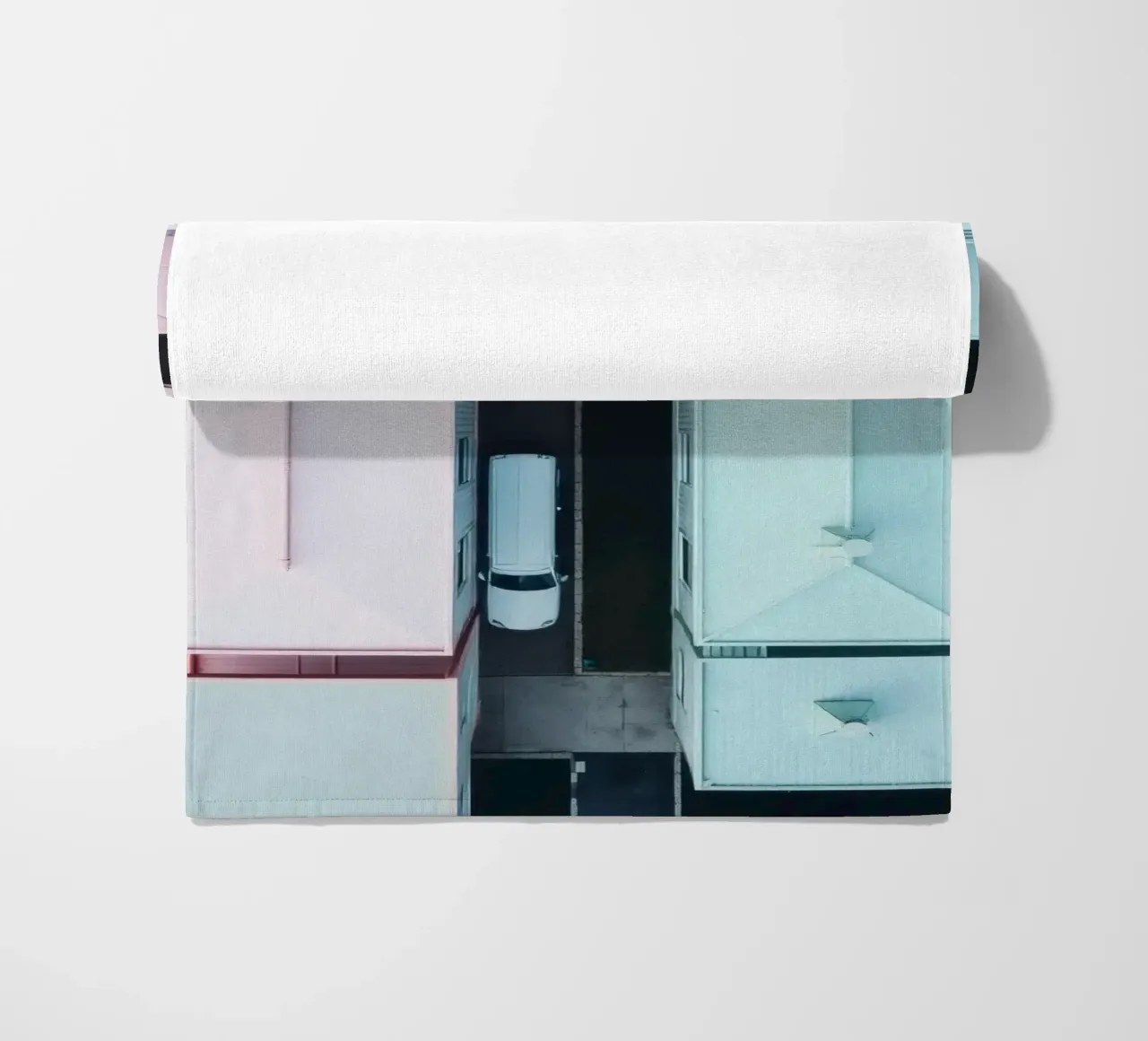 Unique aerial view of pastel-colored buildings with trees beach towel by DesignDoodle