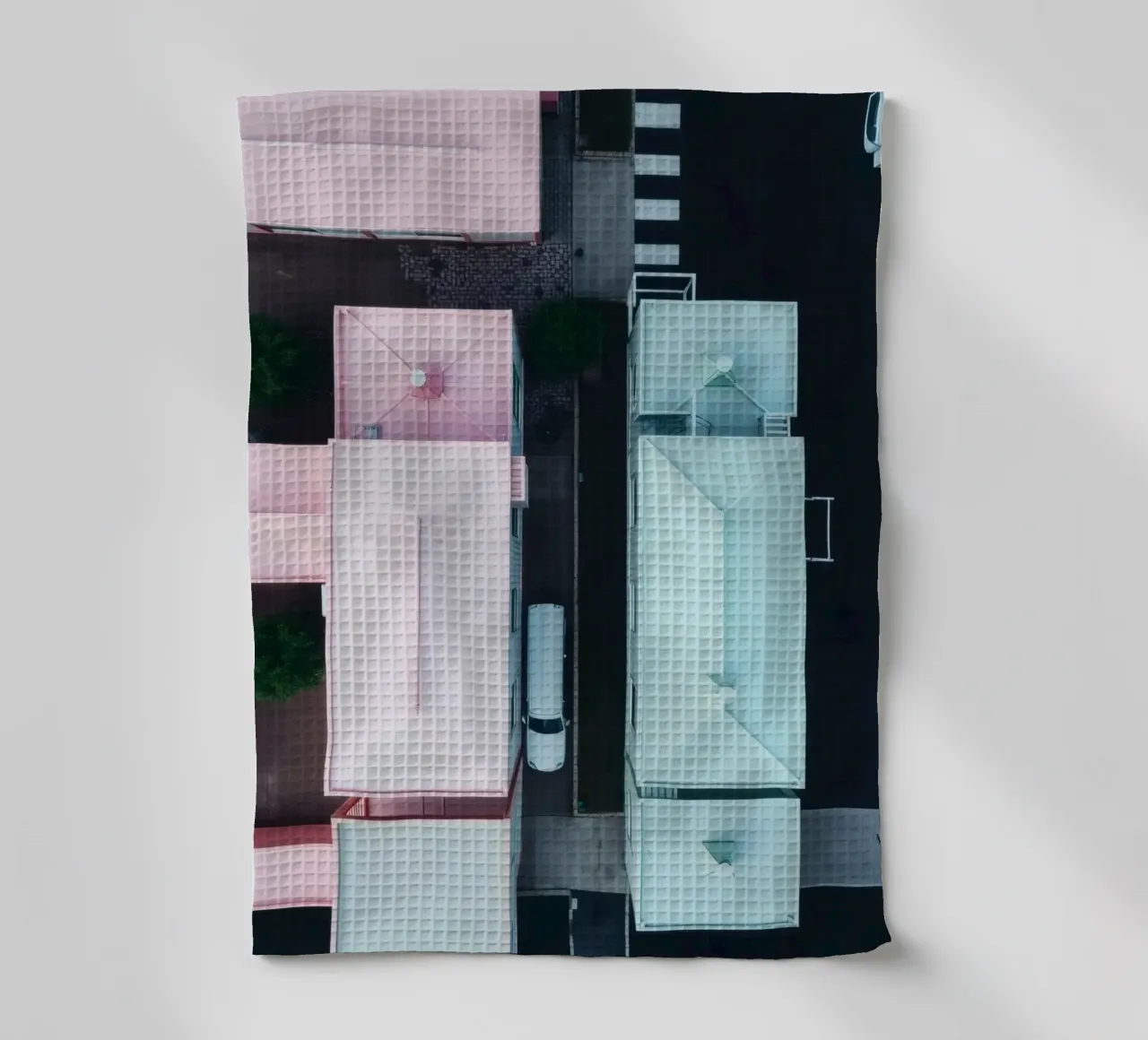 Unique aerial view of pastel-colored buildings with trees tea towel by DesignDoodle