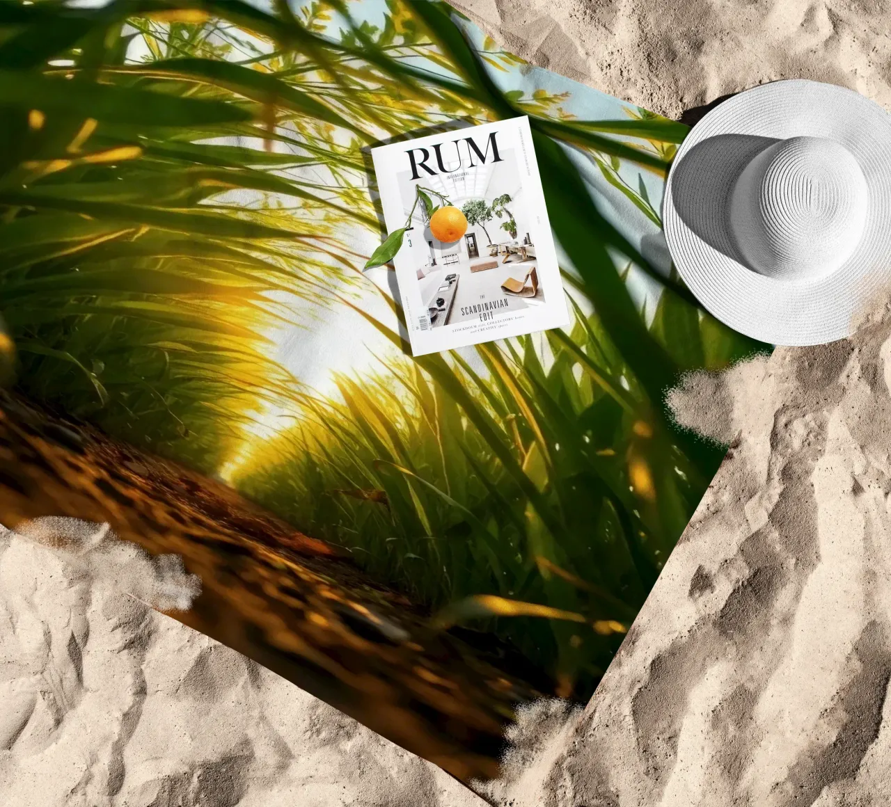 Sunlight filters through tall grass in a calm field beach towel by DesignDoodle