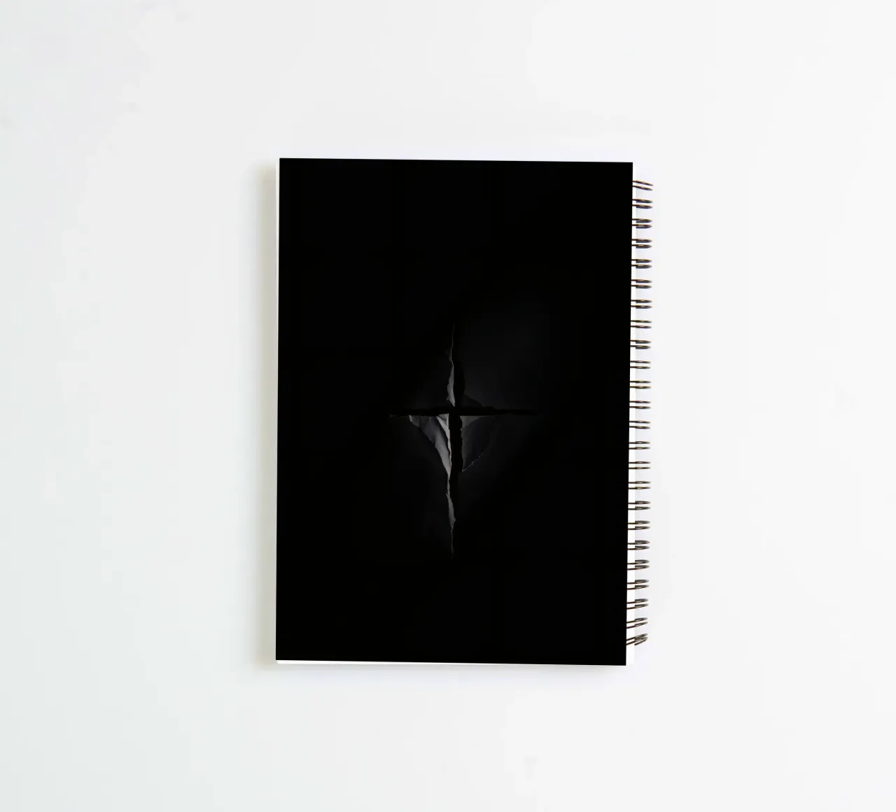 Dark crack in a surface reveals subtle light spiral notebook by DesignDoodle