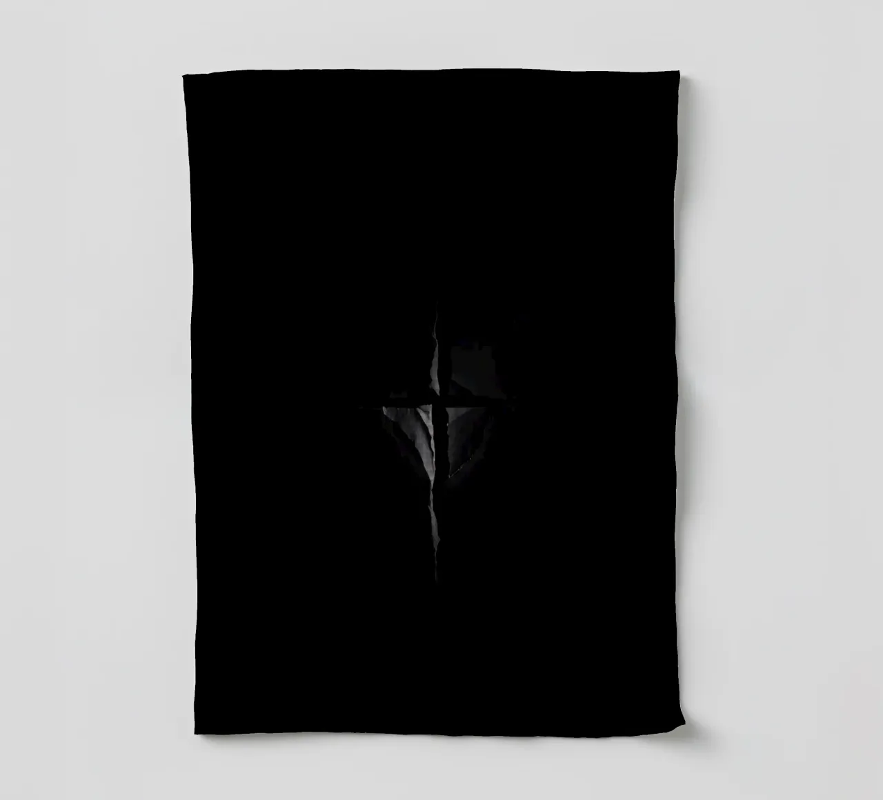 Une fissure sombre dans une surface révèle une lumière subtile torchon de DesignDoodle