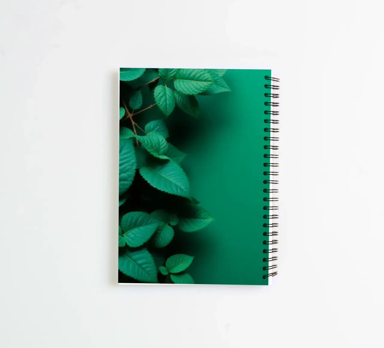 Lush green leaves create a backdrop in a calming nature spiral notebook by DesignDoodle